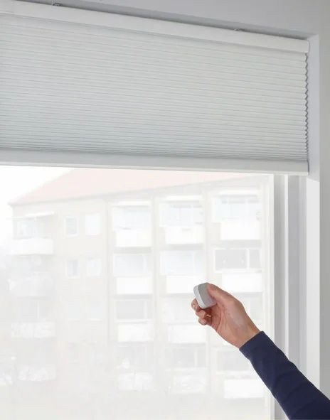 Custom patterned motorized blinds adding a personal touch to interiors.