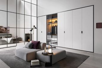 White built-in wardrobe in a minimalist bedroom