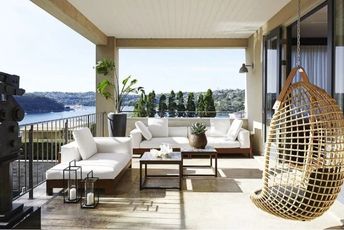 Wooden balcony bench with storage, perfect for Dubai weather.