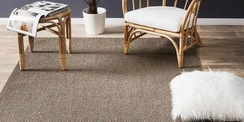 Natural fiber sisal rugs installation in Dubai homes.
